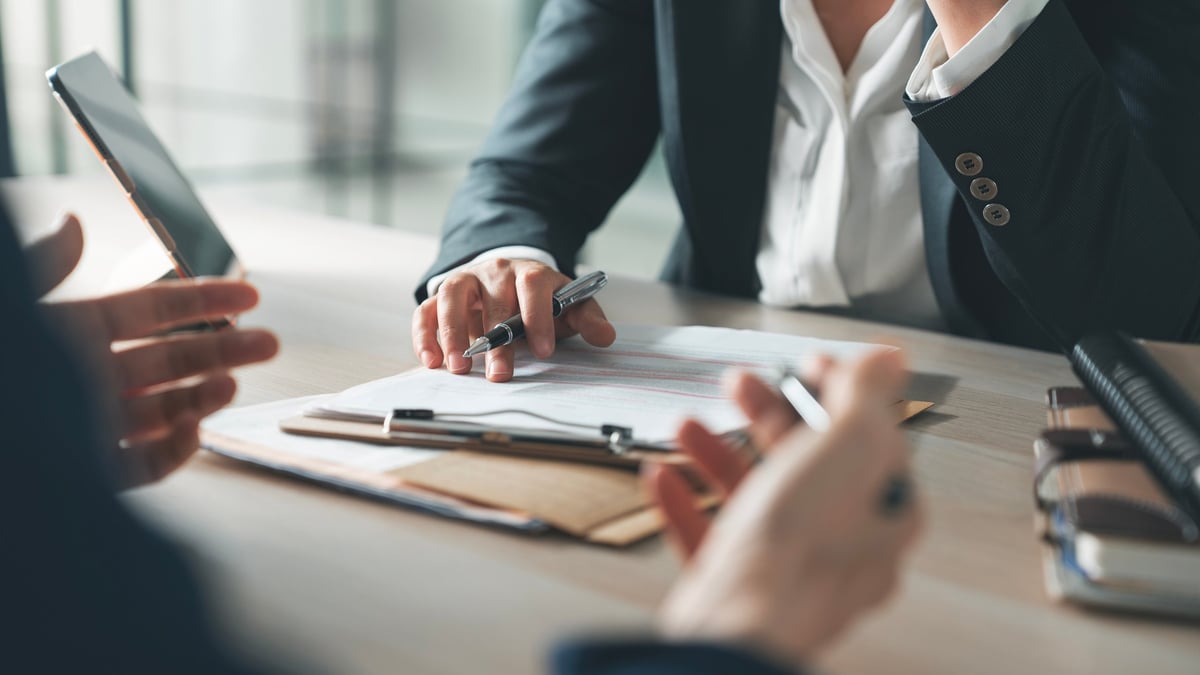 Business professionals collaborating in a warm, modern office