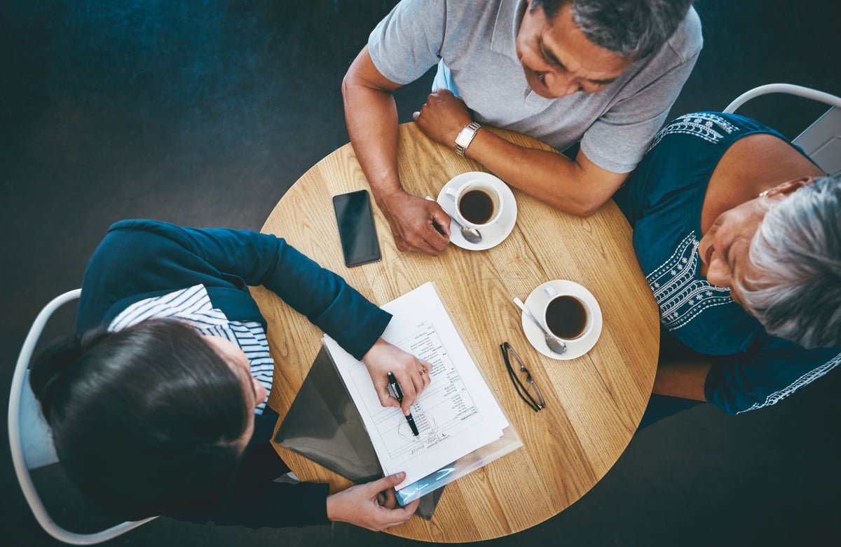 A senior couple meeting with a financial advisor